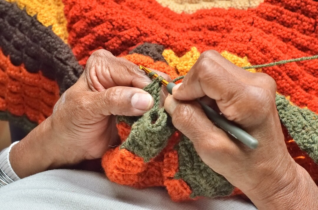 elderly woman knitting